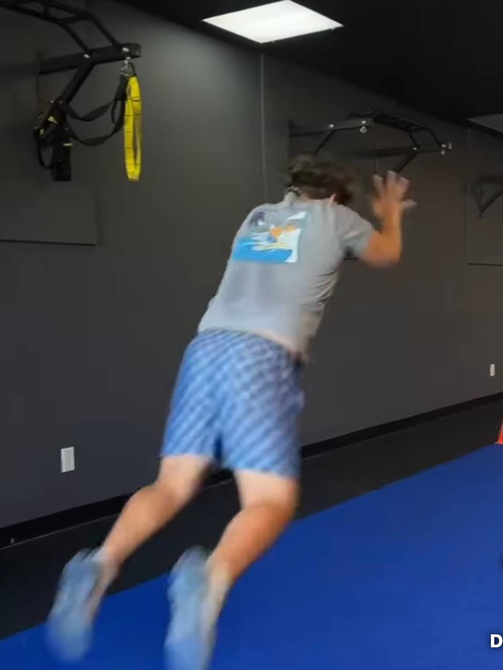 a teen student-athlete from lake highland prep performing power jump under expert supervision at darwin fitness to build speed and prevent injury for competitive sports